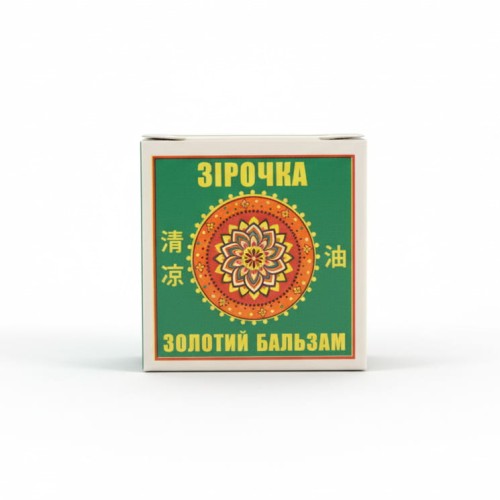 Złoty balsam Ziroczka marki Krasota i Zdrowie w  małym czerwonym pudełeczku z żółtą gwiazdą i zielonym opakowaniu kartonowym. Produkt aromaterapeutyczny o pojemności 4g,  intensywny zapach olejków eterycznych, wspomaga przy zatkanych zatokach, bólu głowy.