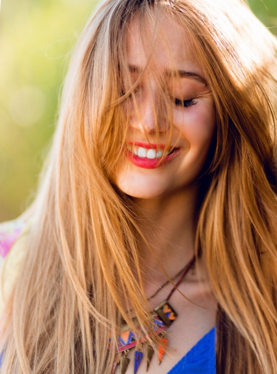 happy-woman-with-windy-blonde-hair-closed-eyes.jpg