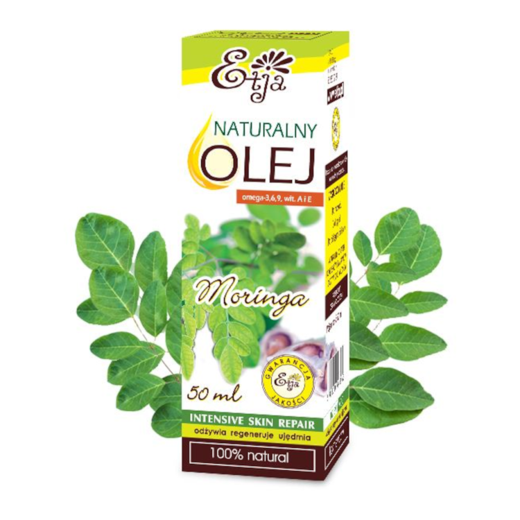 Naturalny olej Moringa marki Etja w kartonowym opakowaniu 50 ml, na tle gałązki krzewu moringa– produkt do pielęgnacji skóry bogaty w kwasy omega i witaminy A i E.